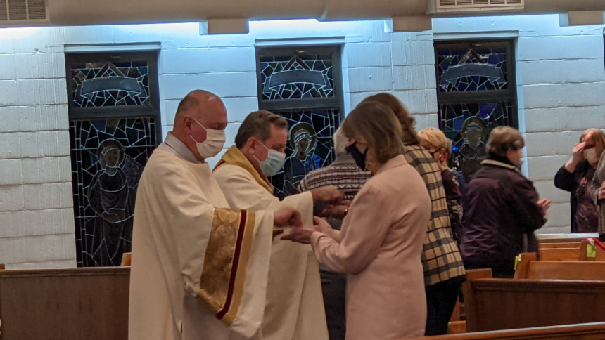Communion at Mass of the Lord's Supper at St. Joan of Arc in 2021
