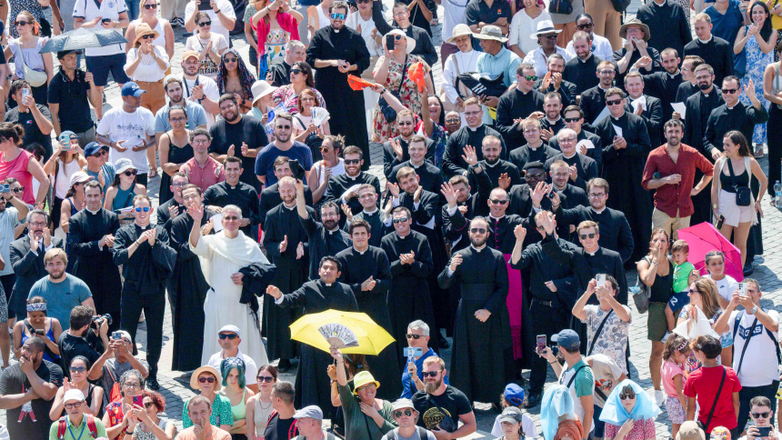 New seminarians and staff from the Pontifical North American College, the U.S. seminary in Rome, wave and cheer as Pope Francis greets them after reciting the Angelus prayer with visitors in St. Peter's Square at the Vatican Aug. 20, 2023. (CNS photo/Vatican Media)