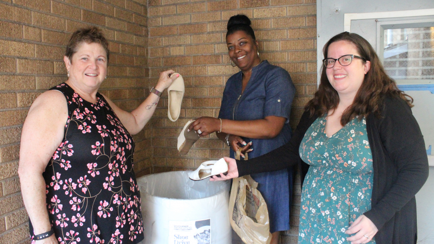Depositing donated shoes in the donation barrel at the main entrance to Sojourner Truth House in Gary are STH ambassador Denise Carney, executive director Angela Paul and STH ambassador Shelley Boyer. The shoe drive, which continues through Aug. 31, accepts new and gently-used pairs of shoes in all sizes and styles at Sojourner Truth House and select churches, banks, and offices throughout the Diocese of Gary. To find the nearest drop-off location, visit sojournertruthohouse.org/shoe-drive/. (Marlene A. Zl