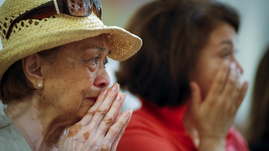 Women weep while they attend the last Mass at the Church of Our Lady of Peace in New York in this file photo dated July 31, 2015. Seventeen Catholic churches across New York City celebrated their last Masses that day as the Archdiocese merged 112 of its 368 parishes into 55, in part because of a shift in Catholic population in some areas. (OSV News photo/Eduardo Munoz, Reuters)