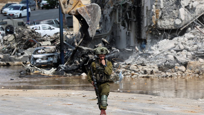 An Israeli soldier patrols near a police station in Sderot, Israel, Oct. 8, 2023, which was destroyed following a mass infiltration by Hamas militants from the Gaza Strip. The attacks have left at least 600 Israelis dead, among them civilians and dozens of soldiers and police who were killed battling the Hamas fighters, and more than 2,000 people are injured. (OSV News photo/Ronen Zvulun, Reuters)