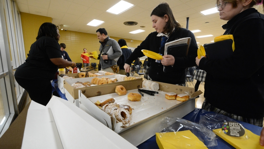 Bishop Noll Institute students select from pasteries during a National School Choice Week Rally at the Hammond school on Jan. 24. BNI's upperclassmen spent part of their day at a motivational presentation about education opportunities delivered by an area pastor and were then treated to sweets from Munster Donut. (Anthony D. Alonzo photo)