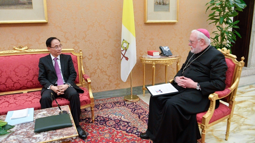 Archbishop Paul R. Gallagher, Vatican foreign minister, meets with Lê Hoài Trung, member of the Communist Party of Vietnam's central committee and chairman of its commission for external relations, at the Vatican Jan. 18, 2024. (CNS photo/Vatican Media)