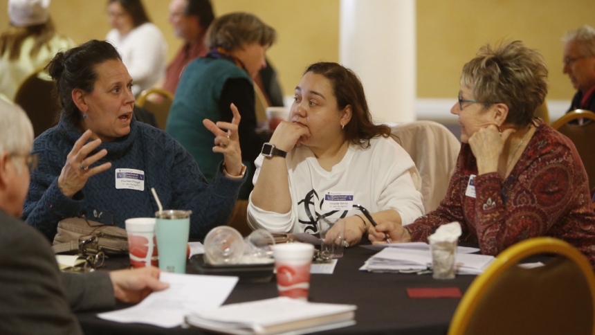 Maureen Progar, Amanada Garcia, both of St. John the Baptist, and Karen Kurfiss, of St. Thomas More engage in discussion during the Diocese of Gary Catechetical Conference at St. Patrick parish on March 2. Nearly 150 catechists from across the diocese attended. (Bob Wellinski photo)
