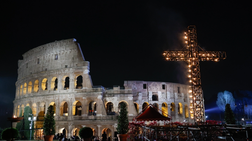 A large illuminated cross is displayed before the start of the Way of the Cross outside the Colosseum in Rome March 29, 2024. (CNS photo/Lola Gomez)