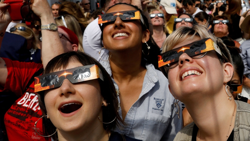 People watch the solar eclipse from the observation deck of The Empire State Building in New York City Aug. 21, 2017. After April 8, 2024, the next total solar eclipse visible in the U.S. will happen in August 2044. (OSV News photo/Brendan McDermid, Reuters)
