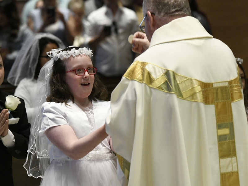 Girl receiving Holy Communion